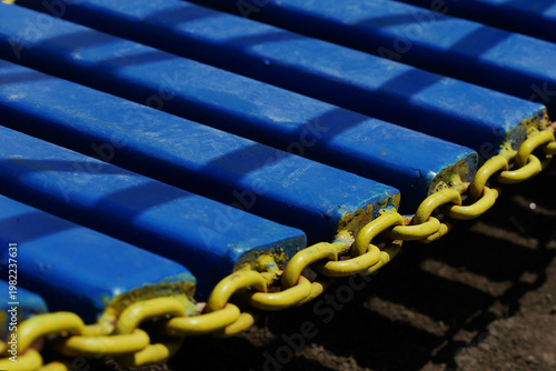 Blue steel bridge in a children's playground.