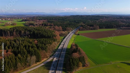 Aerial view of the A95 highway near Starnberg, Germany. The autobahn connects Munich and Garmisch-Partenkirchen, passing through the green Forstenrieder Park forest in Bavaria.