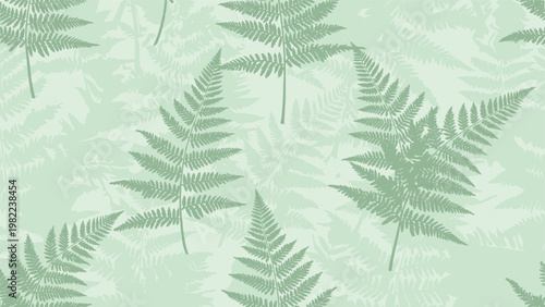 Calm seamless pattern featuring green fern leaves in various orientations and shades over a pale green background for textile prints.