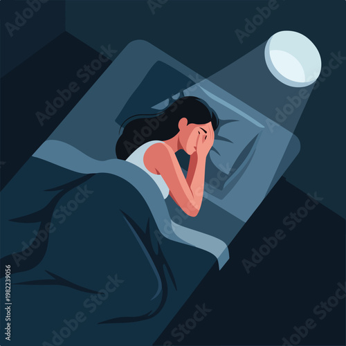Distressed woman lying in bed at night covering her face suffering from insomnia