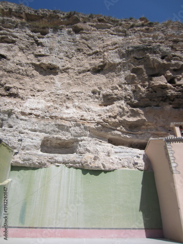 retaining wall against rockface