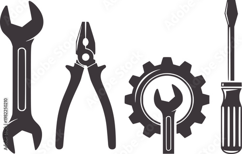 Set of dark grey industrial tools including wrench pliers gear and screwdriver