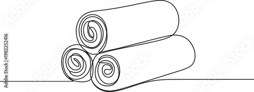 Continuous single line drawing of stacked folded towels representing hygiene spa and laundry concept