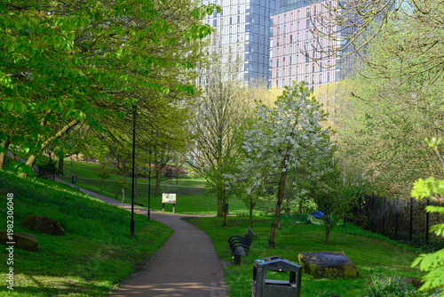 Manchester city park path winding through spring greenery