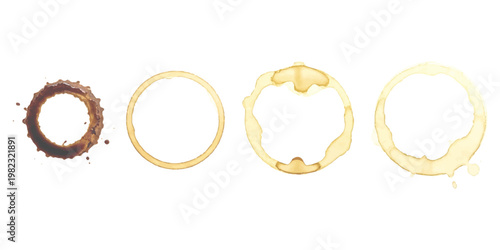 A collection of four distinct circular beverage stains left on a clean white background surface