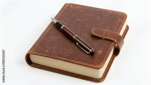Antique leather journal with a classic pen resting on top of it. isolated on white background