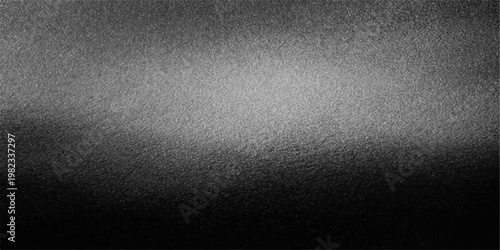 Dark grunge black metal texture with a rough industrial surface pattern and a grey vintage wall material backdrop