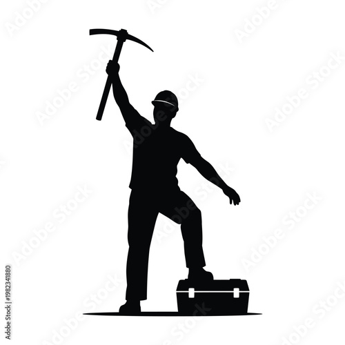Silhouette of a man in a hard hat holding a pickaxe over a toolbox