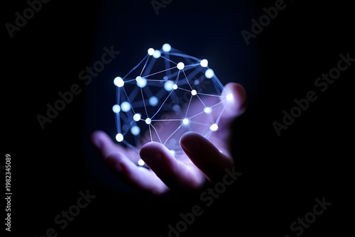 Human hand gently holds a glowing, abstract polygonal sphere representing data connection, global network, or digital future against a dark background.