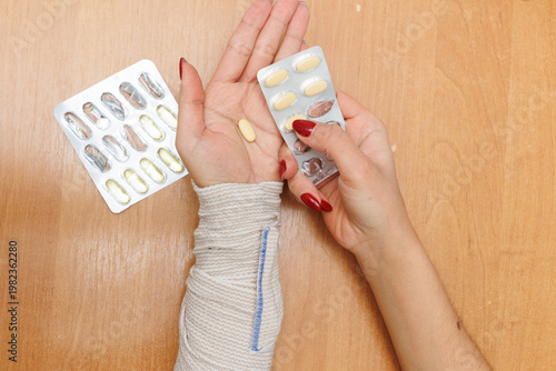 Woman holding pills in hands