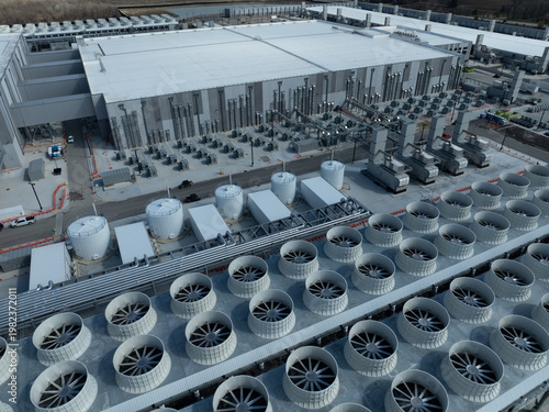 Принти на полотні Aerial view of a large AI data center featuring extensive cooling fans, storage tanks, and industrial systems supporting high-performance computing infrastructure