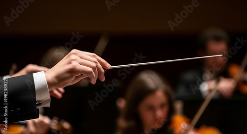 “Orchestra Conductor Holding Baton in Dramatic Concert Lighting”