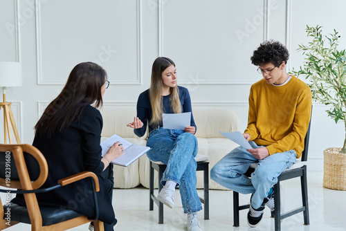 Group therapy, two students working with psychologist, counselor, mentor