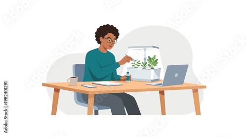 Black woman researching plants in smart indoor garden at her desk