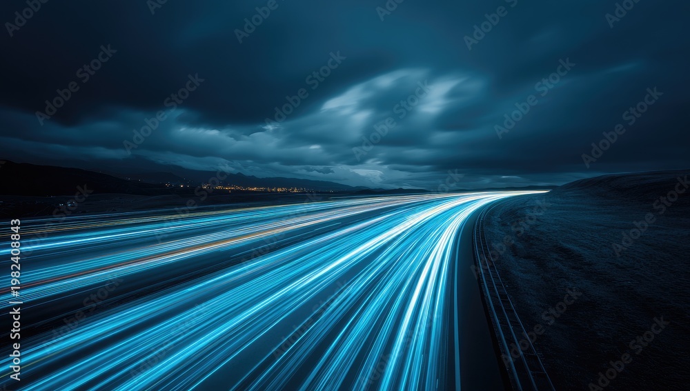 Obraz premium Abstract Light Trails on a Dark Highway at Night.