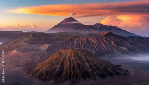 Wide Landscape of Indonesian Volcanic Mountains at Sunrise with Dramatic Orange Clouds and Sea of Fog, Scenic Nature Photography with No People