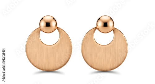 A close-up view of shiny rose gold earring accessories on a white background