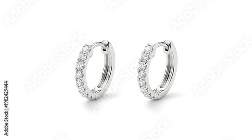 A pair of elegant silver diamond hoop earrings on a white background