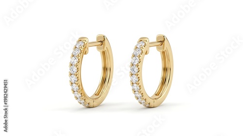 A pair of gold earrings with diamonds are displayed on a white surface.