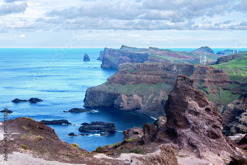 Viewpoint Calhau da Furna do Bode on Madeira, green hills meet sea, discovery archipelago landscape, volcanic island travel, adventure vacation, colorful rooftops, Madeira, Portugal