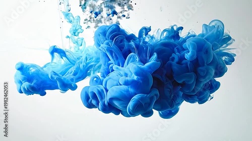 Abstract blue and cyan paint mixing in water against a clean, white background