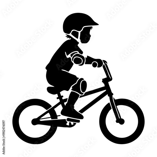 silhouette of a child riding a BMX bike with head protection and elbow protectors