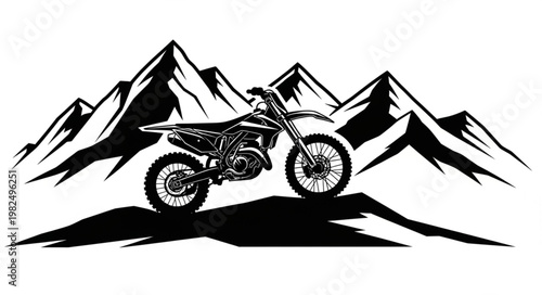 Dirt bike parked on a mountain ridge with peaks behind.