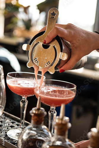 Bartender Pouring Two Pink Cocktails Cosmos 