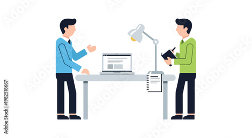 Two professional men standing at a desk with a laptop and lamp, discussing ideas while one takes notes in a notebook.