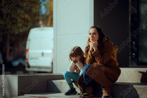 Konstfotografi Bored and Sad Mother and Daughter Waiting Seated on Staircase
