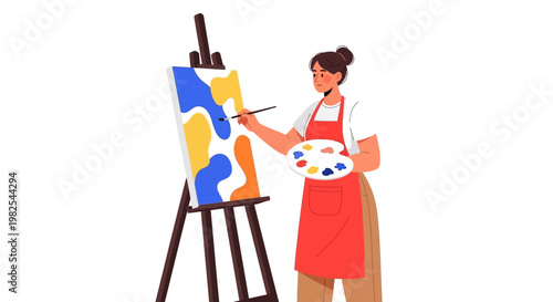 Focused female painter working on abstract masterpiece in studio