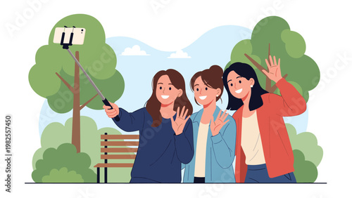Three happy female friends taking a group selfie using a smartphone on a selfie stick while sitting on a bench in a green park.