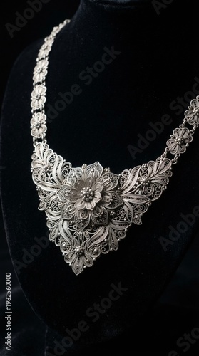 Luxury Indonesian silver filigree jewelry inspired by traditional craftsmanship from Kotagede, Yogyakarta. The intricate handmade silverwork features delicate floral patterns and fine detailing, captu