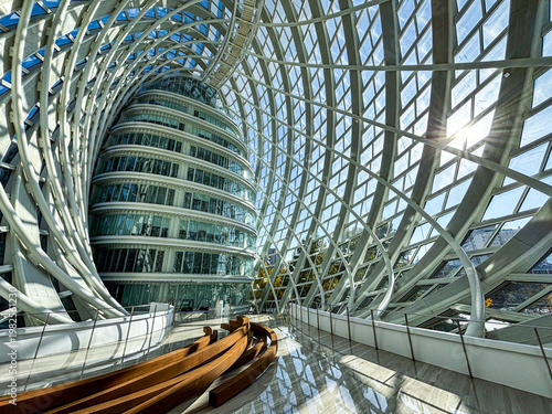 Interior space of Phoenix Center featuring modern steel structure and glass dome in Beijing, China