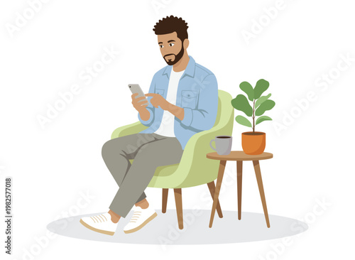 Fotografie Man Using Smartphone While Sitting on Chair at Home.