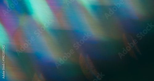 Blur flash leak. Lens prism. Colorful striped holographic light on dark background. Blue green purple luminosity abstract texture.