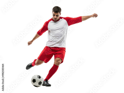 Soccer player kicking a ball in mid air with dynamic movement