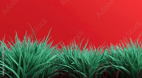 A vibrant green field of grass contrasts sharply against a bold red background, creating a striking and modern visual composition.