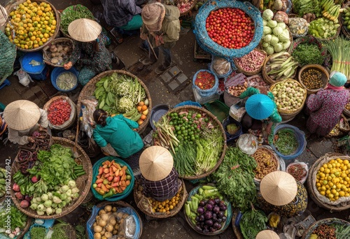 A vibrant aerial view showcases a bustling Vietnamese market filled with colorful produce and vendors.