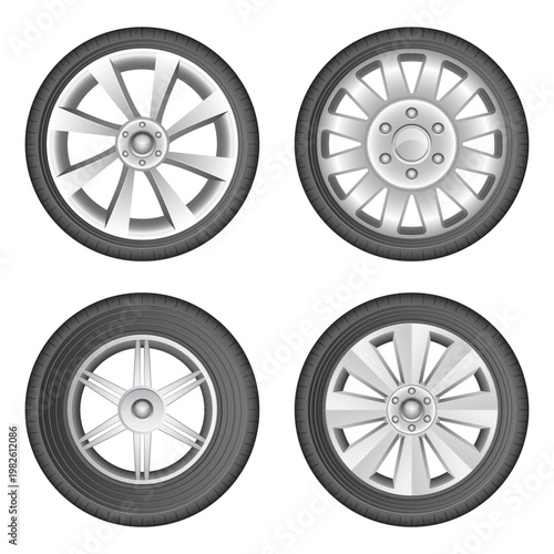 Collection of Four Car Wheels with Distinct Rim Designs Isolated on White