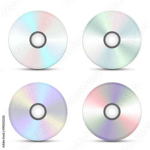 Four colorful compact discs arranged on a plain white background with shadows