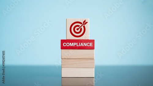 Business compliance concept, target with dart, wooden blocks, regulation