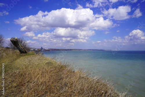 Photos An elevated panoramic view from the grassy bluffs captures the turquoise waters