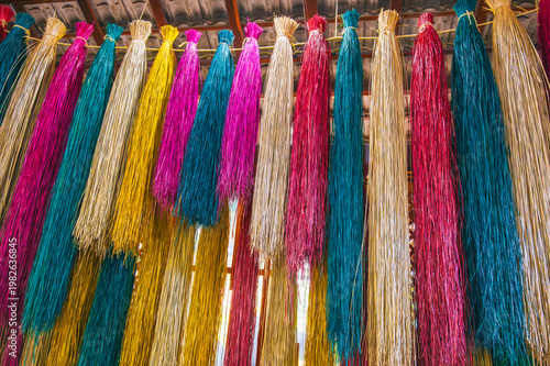 Obraz na plátně Colorful Dyed Raffia Fibers Hanging to Dry