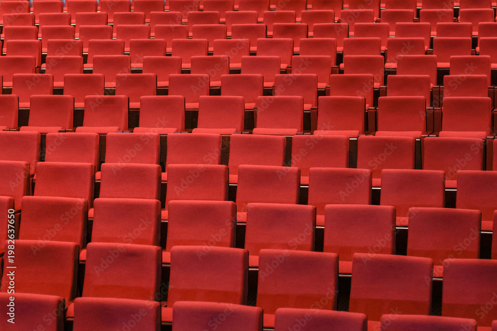 Fototapeta premium Red empty seats in the theater auditorium
