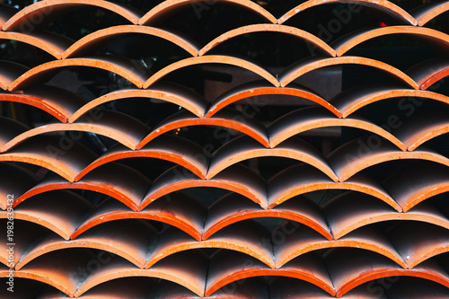 Classic orange corrugated tile, large textured background front view.