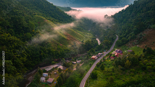 Obraz na płótnie Drone landscape of Sapan Village surrounded by thick morning fog in the mountains of Nan, Thailand
