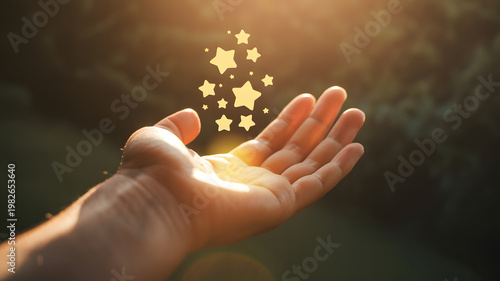 Hand holding glowing stars representing dreams and wishes with warm sunlight and bokeh background conceptual idea.