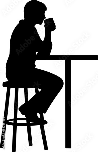 Silhouette of a person sitting on a bar stool at a high table while drinking coffee or tea from a mug