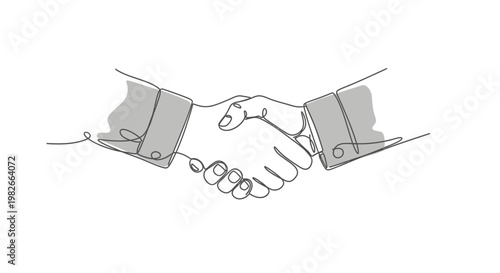 Business partners shaking hands in agreement.